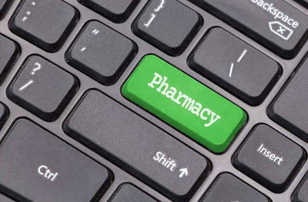 Primer plano del teclado del ordenador con texto "Farmacia" en verde entrar clave — Foto de Stock