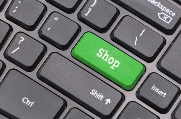 Computer keyboard closeup with "Shop" text on green enter key — Stock Photo, Image