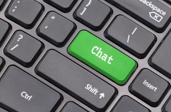 Computer keyboard closeup with "Chat" text on green enter key — Stock Photo, Image