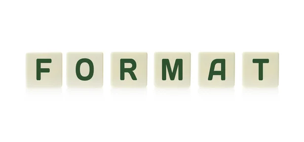 Word "Format" aan boord van spel vierkant plastic tegel stukken, geïsoleerd op een witte achtergrond. — Stockfoto