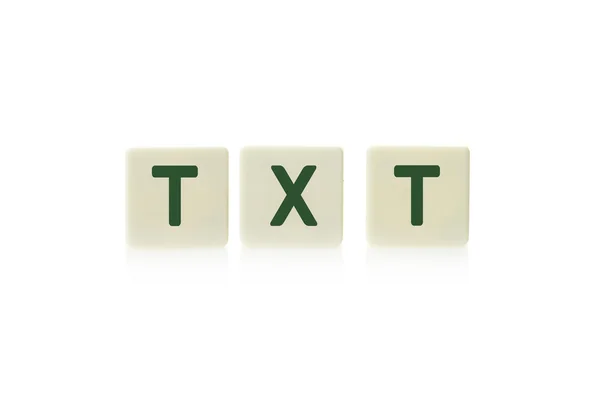 Mot "TXT" sur le jeu de société morceaux carrés de tuiles en plastique, isolé sur un fond blanc . — Photo