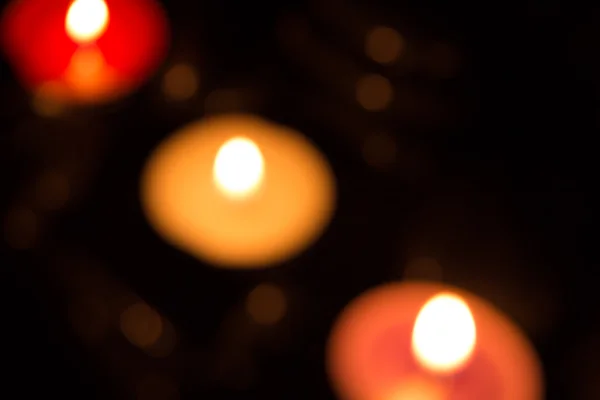 Fondo abstracto con luces de velas de colores y bokeh — Foto de Stock