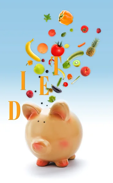 Piggy bank with fruits and vegetables — Stock Photo, Image