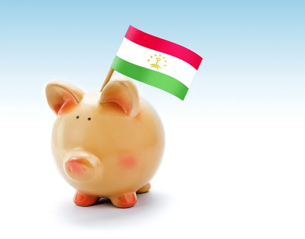 Piggy bank Tádzsikisztán zászlaja — Stock Fotó