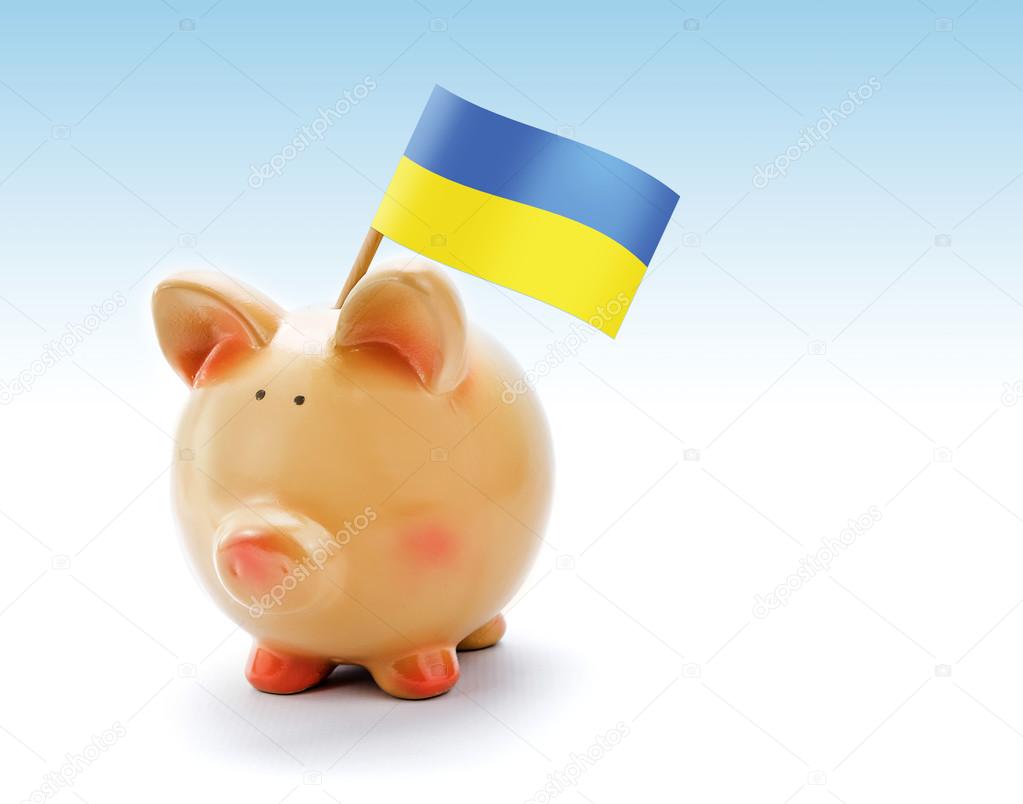 Piggy bank with national flag of Ukraine