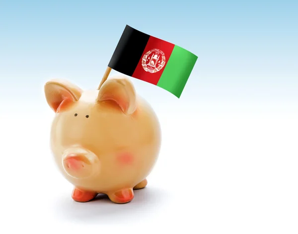 Piggy bank dengan bendera nasional Afghanistan — Stok Foto