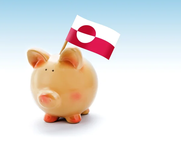 Банк свиней с национальным флагом Гренландии — стоковое фото