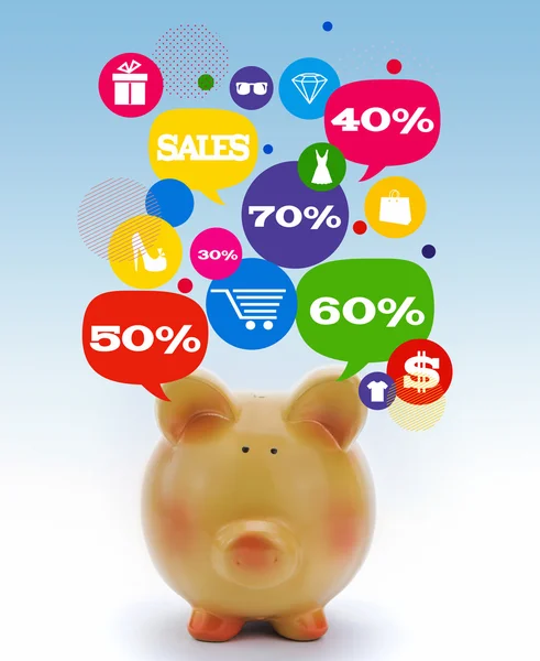 Piggy bank with sale icons in talk bubbles — Stock Photo, Image