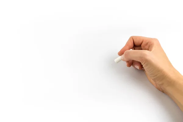 Hand som håller krita isolerad på vit bakgrund — Stockfoto