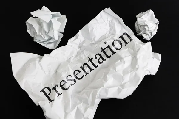 Crumpled paper sheet with word Presentation isolated on black — Stock Photo, Image