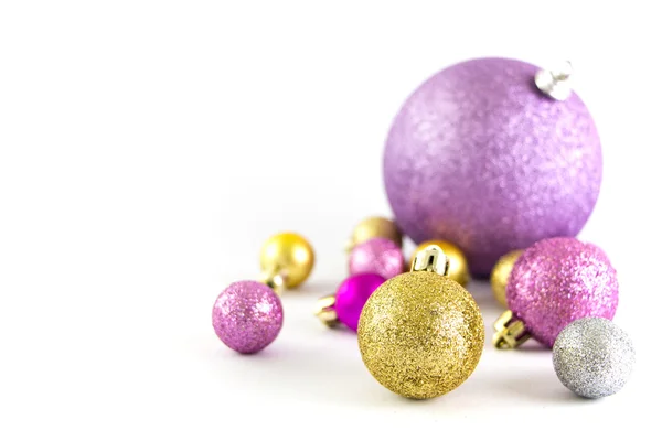 Various sized and colored Christmas balls isolated on white — Stock Photo, Image