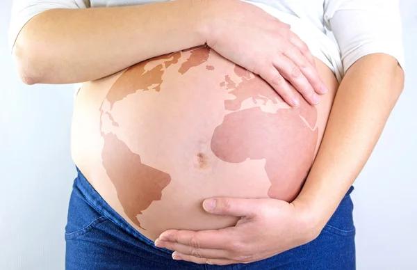 Pregnant woman belly with earth illustration — Stock Photo, Image