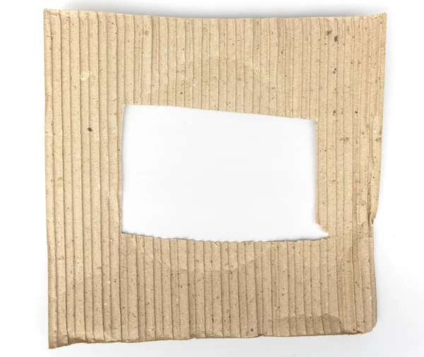 Old cardboard paper with hole in the middle — Stock Photo, Image