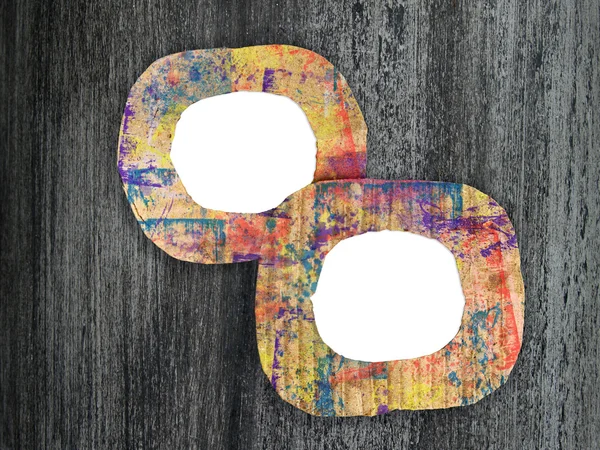 Dos marcos de cartón pintados de colores en blanco sobre fondo grunge — Foto de Stock
