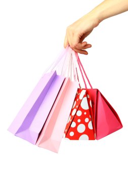 renkli alışveriş torbaları üzerinde beyaz izole tutmak el