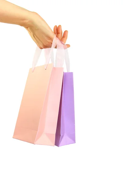 Hand holding colorful shopping bags isolated on white — Stock Photo, Image