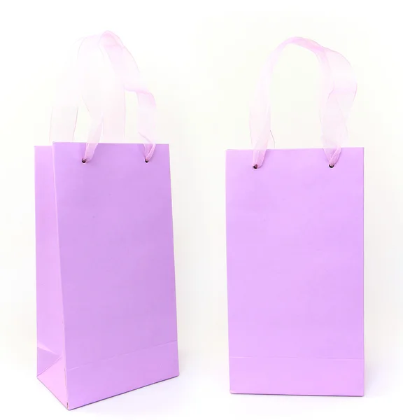 Pastel saco de compras lilás, vista frontal e lateral, isolado em branco — Fotografia de Stock