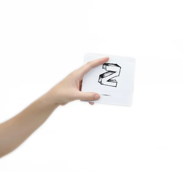 Hand holding a piece of paper with sketchy capital letter Z, isolated on white. — Stok fotoğraf