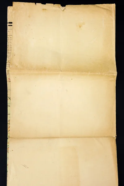 Old grunge crumpled paper sheet, isolated on black background. — Stock Photo, Image