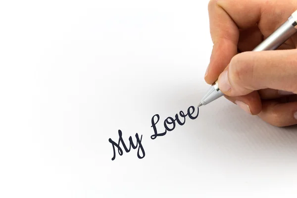 Escribir a mano "Mi amor" en una hoja de papel blanco . — Foto de Stock