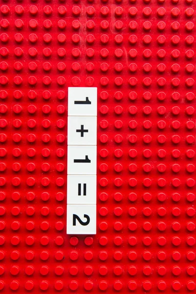 Ladrillo rojo mostrando números — Foto de Stock