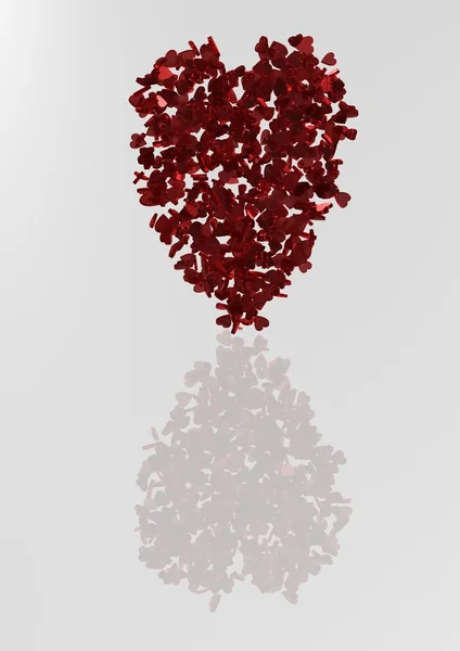 Červené srdce tvaru vyrobené z malých srdcí. — Stock fotografie