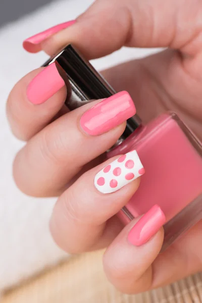 Fingernails with pink and white nail polish