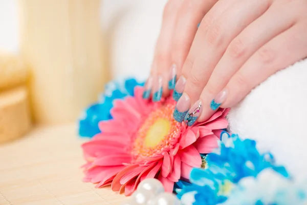 Fingernails with glitter blue and silver polish — Stock Photo, Image