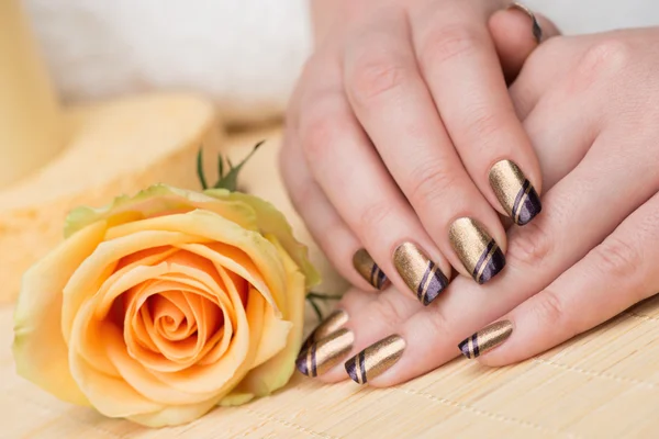 Hands with nice holiday nail art — Stock Photo, Image