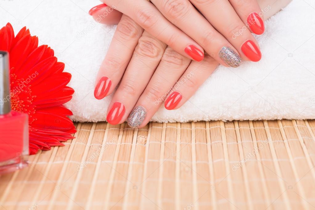 Red manicured woman fingernails