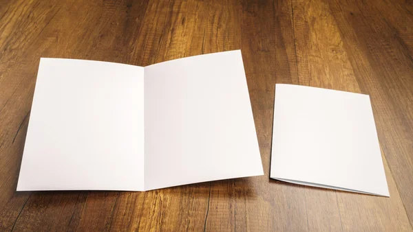 Bifold white template paper on wood texture — Stock Photo, Image