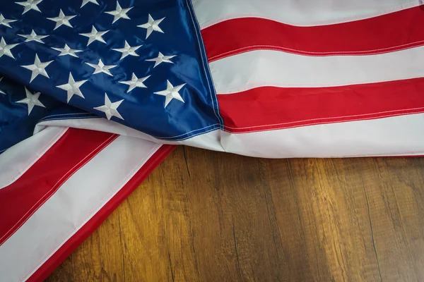 American flag on wood table — Stock Photo, Image