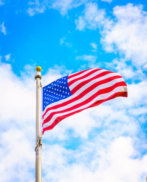 American flag on blue sky