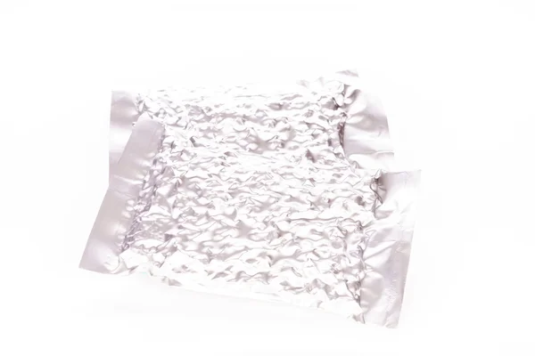 Paket tas foil pada latar belakang putih — Stok Foto