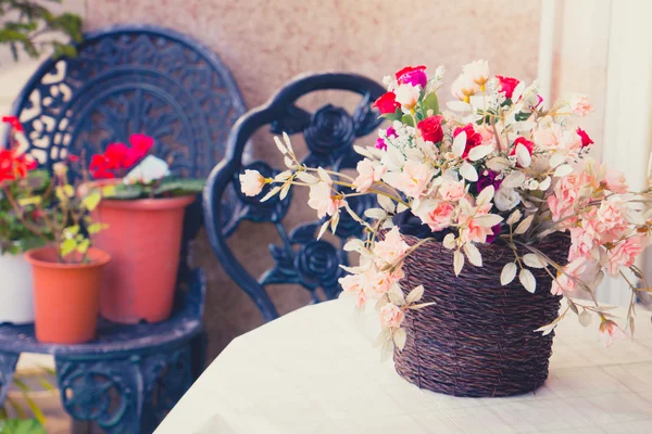 Decoration artificial flower on table ( Filtered image processed — Stock Photo, Image