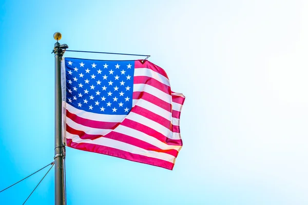 American flag on blue sky — Stock Photo, Image