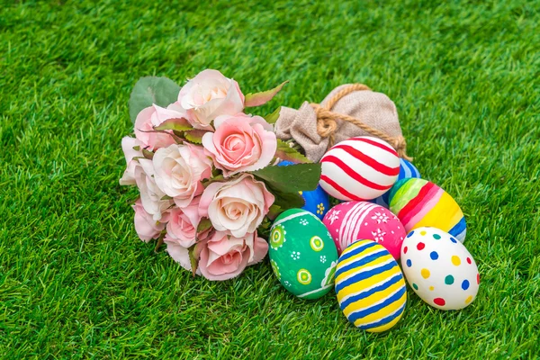 Easter eggs with artificial flowers — Stock Photo, Image
