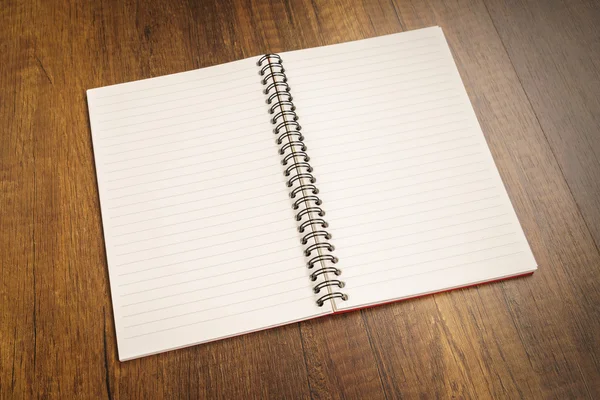 Note book on a wooden desk — Stock Photo, Image