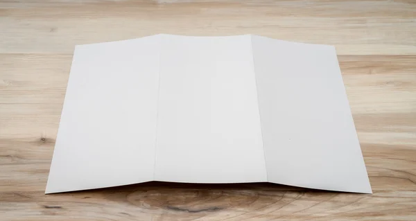 Trifold white template paper on wood textur — Stock Photo, Image