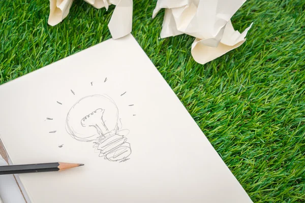 Book and light bulb of idea — Stock Photo, Image