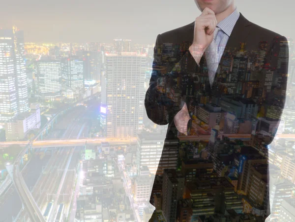 Double exposure of businessman with cityscape — Stock Photo, Image