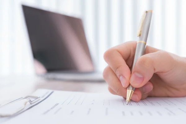 Hand with pen over application for — Stock Photo, Image