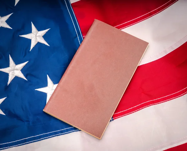 Passport on an American flag — Stock Photo, Image