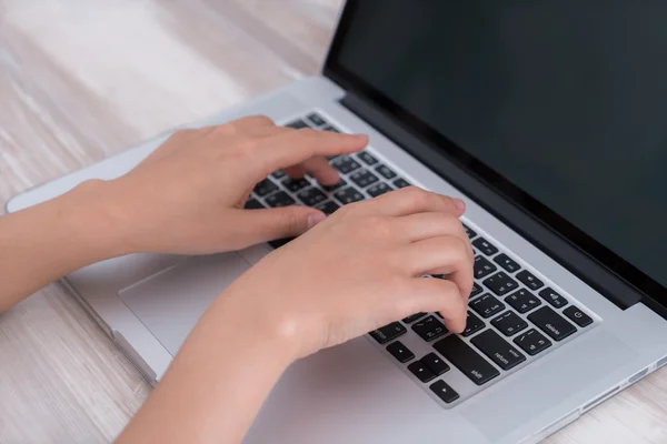 Person typing on laptop keyboard — Stock Photo, Image