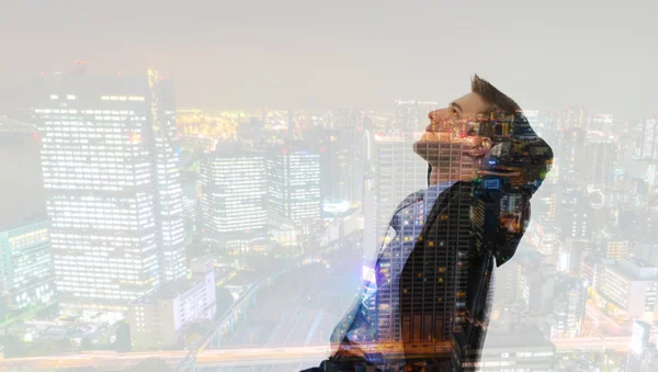 Double exposure of businessman with cityscape — Stock Photo, Image