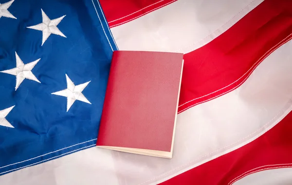 Passport on an American flag — Stock Photo, Image