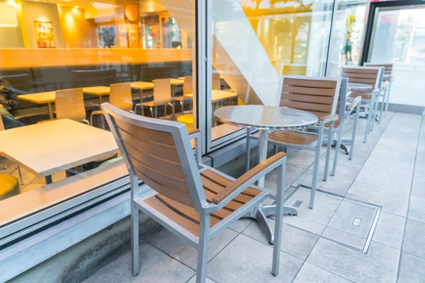 Tables and chairs in restaurant — Stock Photo, Image