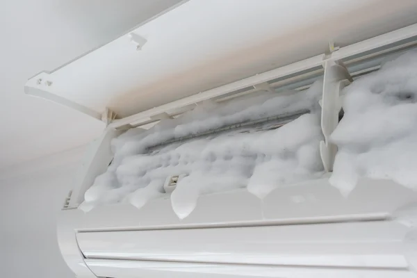 Air conditioner cleaning with washing foam . — Stock Photo, Image