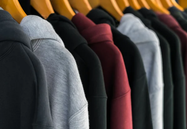 Row of Fashionable clothing on hangers . — Stock Photo, Image