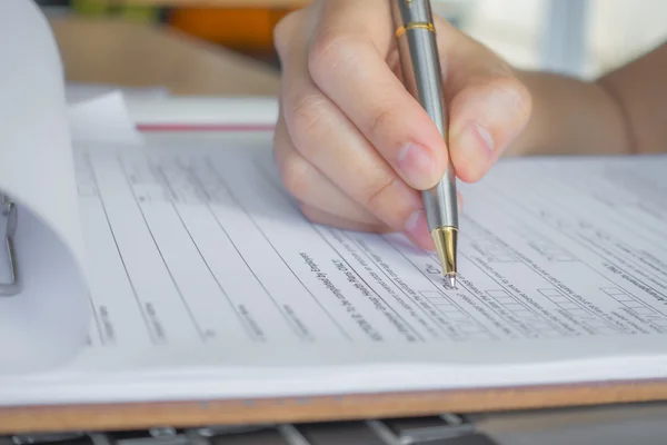 Hand with pen over application form . — Stock Photo, Image